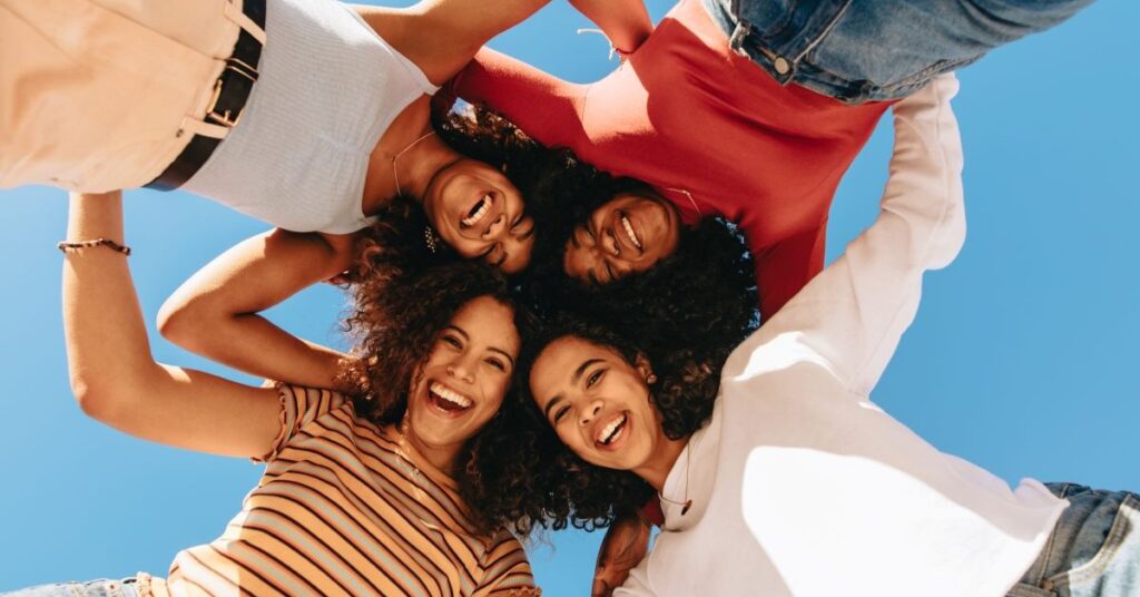 Low angle view of four smiling women